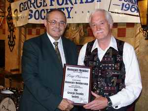 Tony Thornton receives his award from President of the GFS, Dennis Taylor.