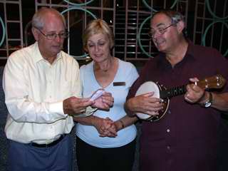 John, Kathryn and Dennis check the winning ticket.