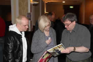 Treasurer Andrew Gatherer welcomes two members.