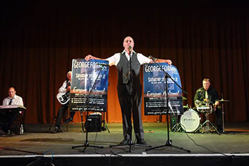 Gerry auctions a poster